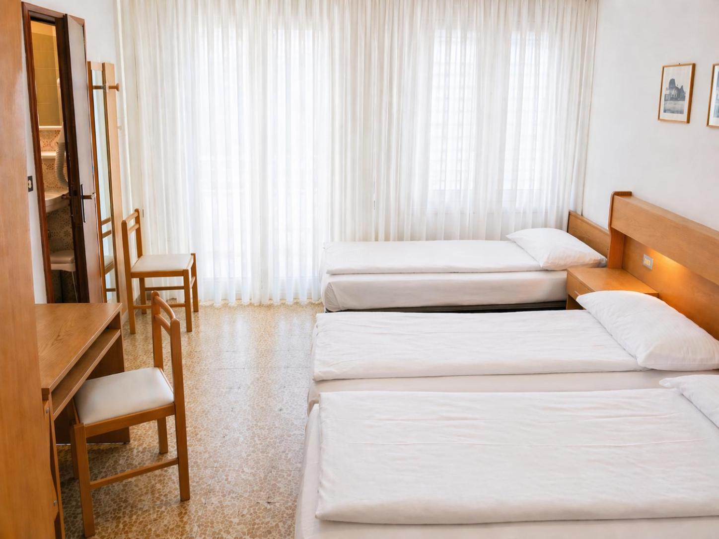 Dreibettzimmer mit Balkon